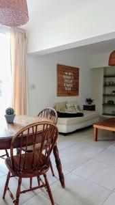 a room with a bed and a table and chairs at Casa bohé Casilda in Casilda