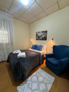 Postel nebo postele na pokoji v ubytování Hostal Real