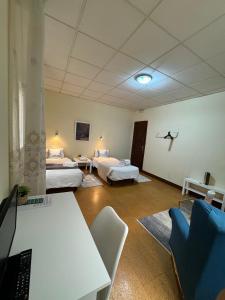 Postel nebo postele na pokoji v ubytování Hostal Real