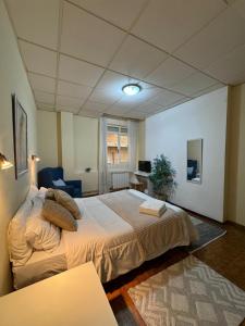 Postel nebo postele na pokoji v ubytování Hostal Real