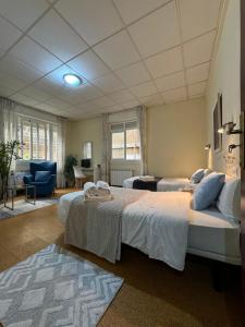 Postel nebo postele na pokoji v ubytování Hostal Real