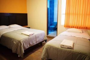 Postel nebo postele na pokoji v ubytování Hostal POSADA LA TABITA