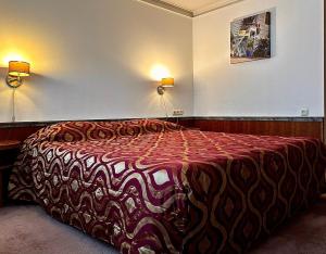 Postel nebo postele na pokoji v ubytování Hotel De hertog Franeker