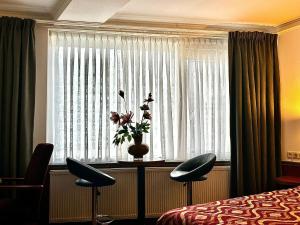 Postel nebo postele na pokoji v ubytování Hotel De hertog Franeker