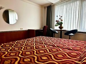 Postel nebo postele na pokoji v ubytování Hotel De hertog Franeker