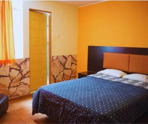 Postel nebo postele na pokoji v ubytování Hostal POSADA LA TABITA