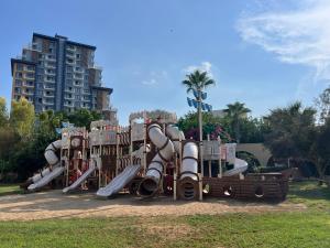 a playground with a slide in a park at Caesar Resort Didious in Iskele