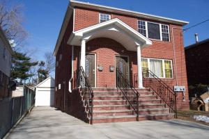 a red brick house with stairs in front of it at Tonel Paradise in Rosedale +5 photos
