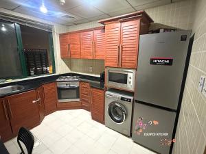 Cucina o angolo cottura di Nomad Partition Room in Barsha Heights 3 mins to ICM Metro