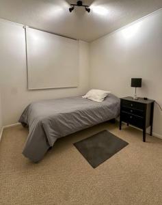 En eller flere senge i et værelse på Acogedor depto en La Serena