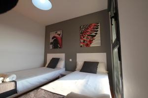 Posteľ alebo postele v izbe v ubytovaní For a Stay Las Dunas