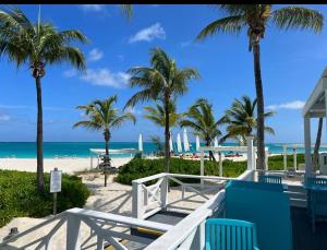 a beach with palm trees and the ocean at Caesar Resort Didious in Iskele