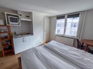Ένα ή περισσότερα κρεβάτια σε δωμάτιο στο stattHotel