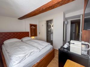 Ένα ή περισσότερα κρεβάτια σε δωμάτιο στο stattHotel