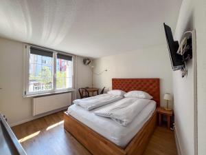 Ένα ή περισσότερα κρεβάτια σε δωμάτιο στο stattHotel