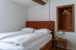 Ένα ή περισσότερα κρεβάτια σε δωμάτιο στο stattHotel