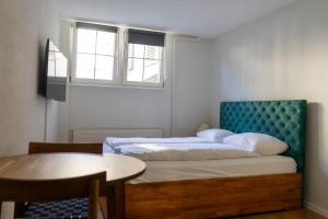 Ένα ή περισσότερα κρεβάτια σε δωμάτιο στο stattHotel