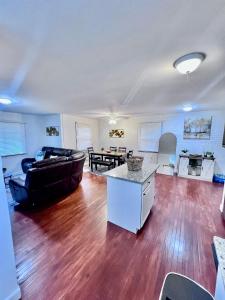 a living room with a couch and a table at Comfortable 3BR Close to All in Dayton