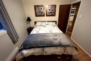 a bedroom with a bed in a room at Cozy Country Vacation Home in Scoudouc