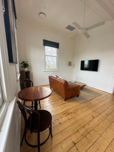 a living room with a couch and a table at ARK Apartments in Echuca