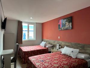 Ένα ή περισσότερα κρεβάτια σε δωμάτιο στο Hotel Teresita