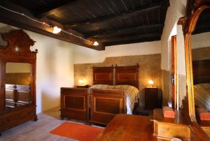A bed or beds in a room at La Rocca - Palazzo Pallotti