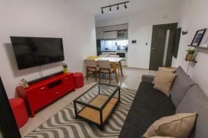 TV a/nebo společenská místnost v ubytování Divino departamento con garage