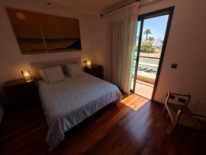 Ένα ή περισσότερα κρεβάτια σε δωμάτιο στο Casa Palmeras