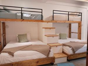 two bunk beds in a room with white walls at Villa Silana in Moalboal +31 photos