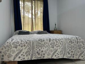 Voodi või voodid majutusasutuse Hostel Cora Chía toas