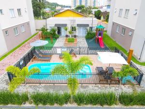 Πισίνα στο ή κοντά στο Santorini Home Club | 250m da praia central | Piçarras