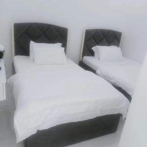 Postel nebo postele na pokoji v ubytování ANTIKA HOTEL / انتيكا للشقق الفندقيه