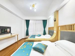 Postelja oz. postelje v sobi nastanitve 舒山居人文客栈