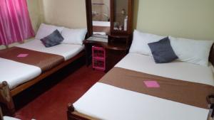 Кровать или кровати в номере Haranya Homestay