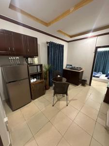 a living room with a kitchen and a table at Shaiz Luxe Apartments Bhurban Murree in Murree +26 photos