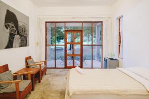 Postel nebo postele na pokoji v ubytování Loogmai Guesthouse Chiang Khan - เรือนแรมลูกไม้ เชียงคาน