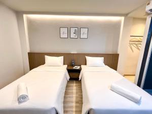 Bedter Hotel Phang Nga客房内的一张或多张床位