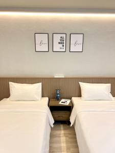 Bedter Hotel Phang Nga客房内的一张或多张床位
