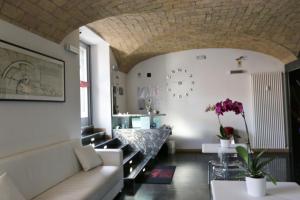 a living room with a couch and a table at Residenza Adriana in Rome