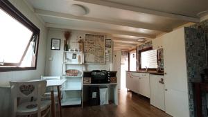 a kitchen with a table and a counter top at Domček na samote in Nové Mesto nad Váhom