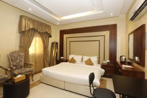 Ένα ή περισσότερα κρεβάτια σε δωμάτιο στο Hotelier Suites by Cantonal