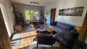 a living room with a couch and a table at Luchshuette in Sankt Andreasberg