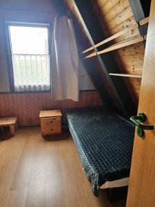 Ein Bett oder Betten in einem Zimmer der Unterkunft Ferienhaus 196 in Fedderwardersiel