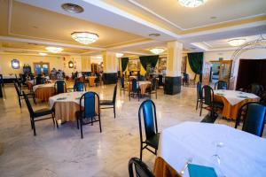 a dining room with tables and chairs in a restaurant at Villa de Gor in Gor