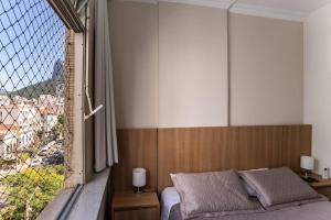 Ein Bett oder Betten in einem Zimmer der Unterkunft Botafogo 2qts - moderno e sofisticado com vaga
