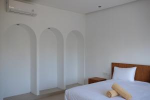 Postel nebo postele na pokoji v ubytování Dipenida Bali