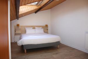 Katil atau katil-katil dalam bilik di Résid'Spa Loire & Sèvre - Appartement