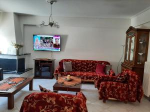 A television and/or entertainment centre at beautiful apartment near the beach