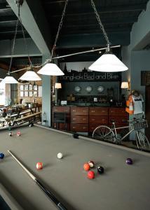 a pool table with balls on it in a room at Bangkok Bed and Bike in Bangkok