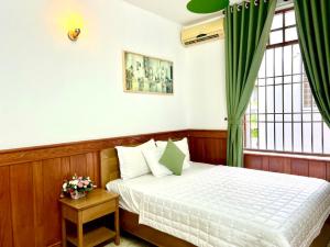 a bedroom with a bed and a window at Rio 02 homestay in Vung Tau +21 photos